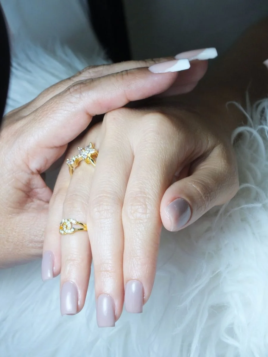 Close-up of elegant manicured nails and refined hand styling at Helvona Savialisse
