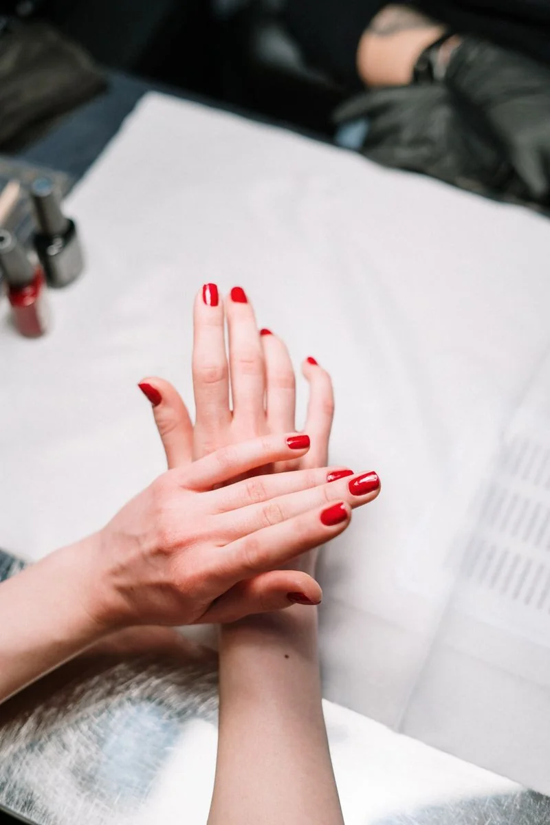 Display of rich neutral and crimson nail shades